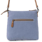 Back view of Myra Itsy Bitsy Crossbody Bag with blue canvas and exterior zipper pocket