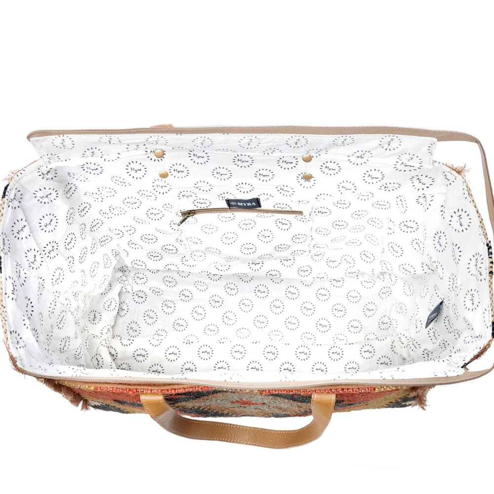 Interior view of the Myra Kaliko Hill Canvas Weekender Bag showing the spacious patterned lining and interior zipper pocket.
