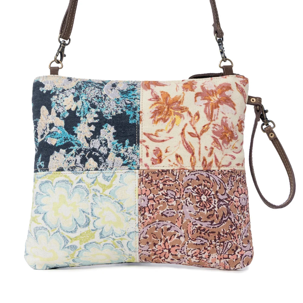 Back view of Myra Le Piccolo Crossbody Bag with multicolor floral patchwork canvas and wrist strap