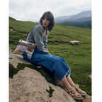 Lifestyle view of Myra Le Piccolo Crossbody Bag with colorful floral patchwork canvas and brown leather accents