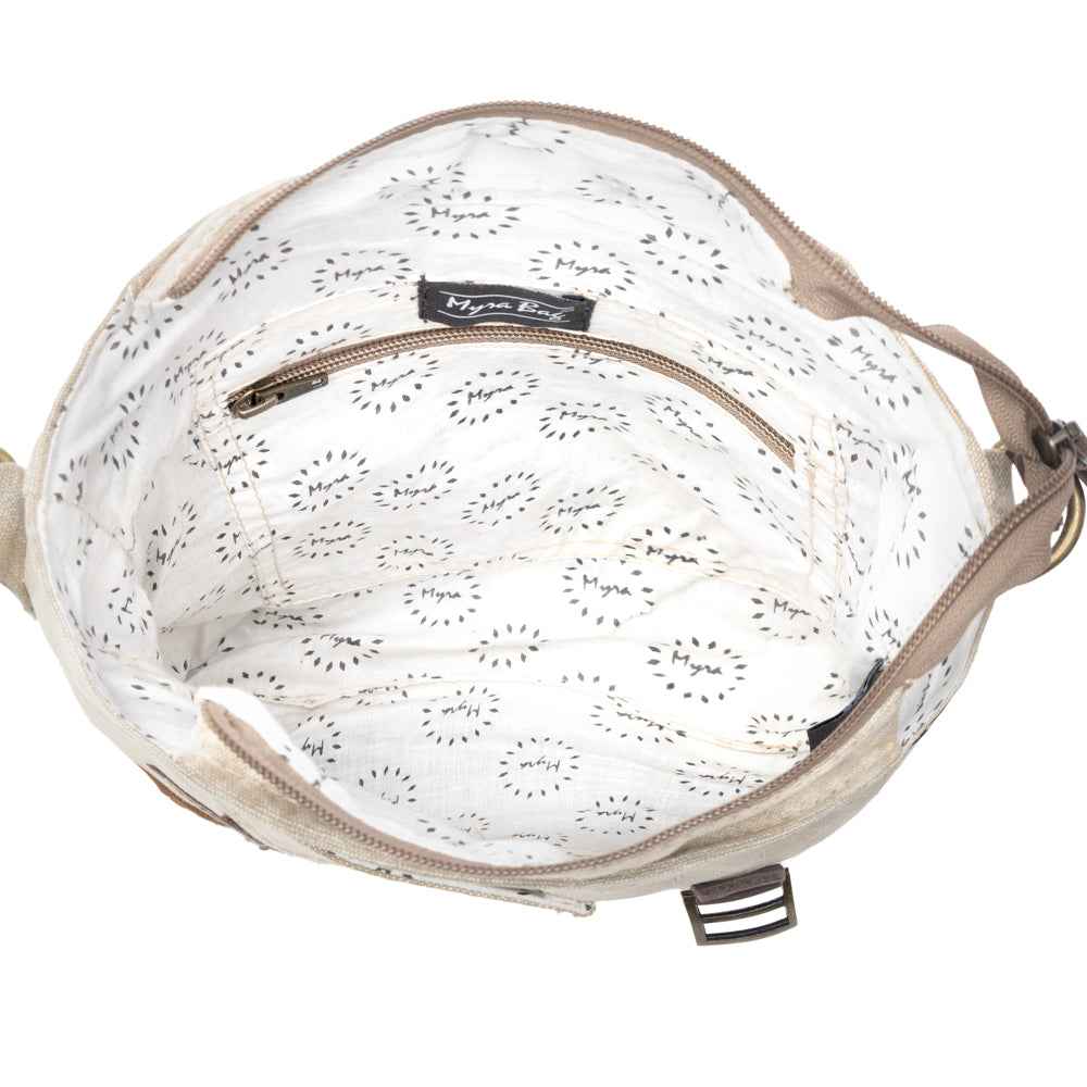 Interior view of Myra Leather Star Crossbody Bag with patterned cotton lining and interior zipper pocket