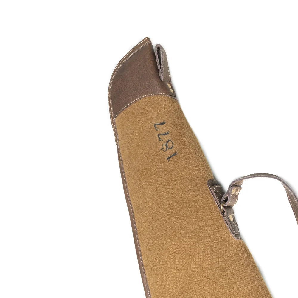 Close-up of Antique Olive Myra rifle case with leather trim and shoulder strap