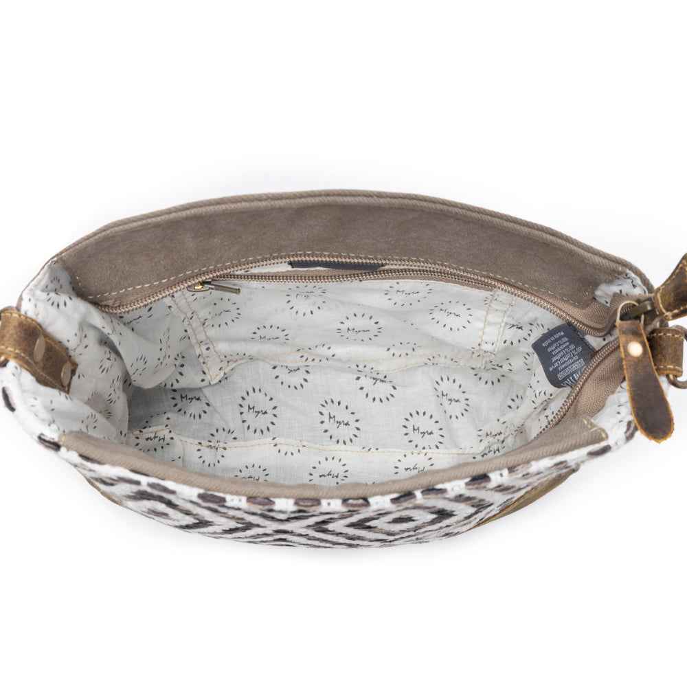 Interior view of Myra Precision Crossbody Bag with patterned cotton lining and interior zipper pocket