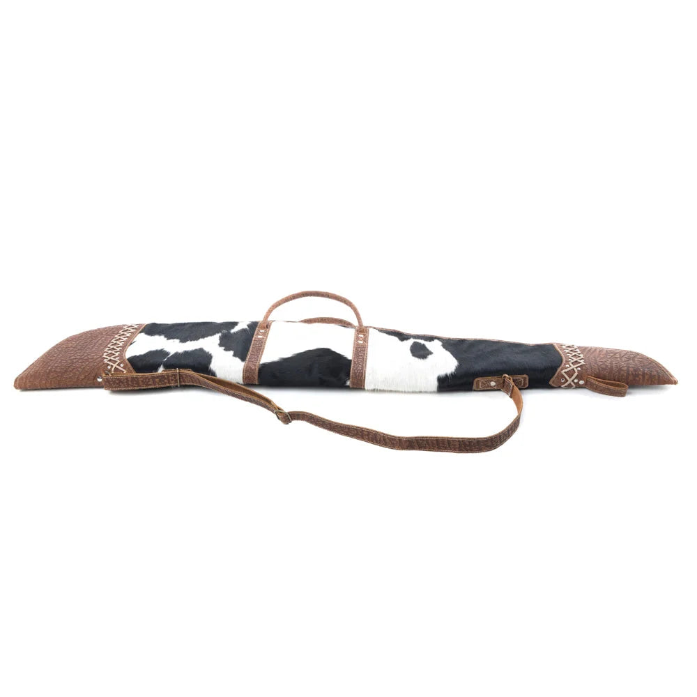 Side view of Myra Range Crest Hairon Gun Case in Frost with black and white hairon and brown leather strap