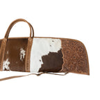 Close-up of Myra Redstone Divide gun case S-14663 with hand-tooled leather and brown and white hair-on hide