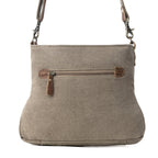 Back view of Myra Saplings Shoulder Bag with gray canvas and exterior zipper pocket with leather accents