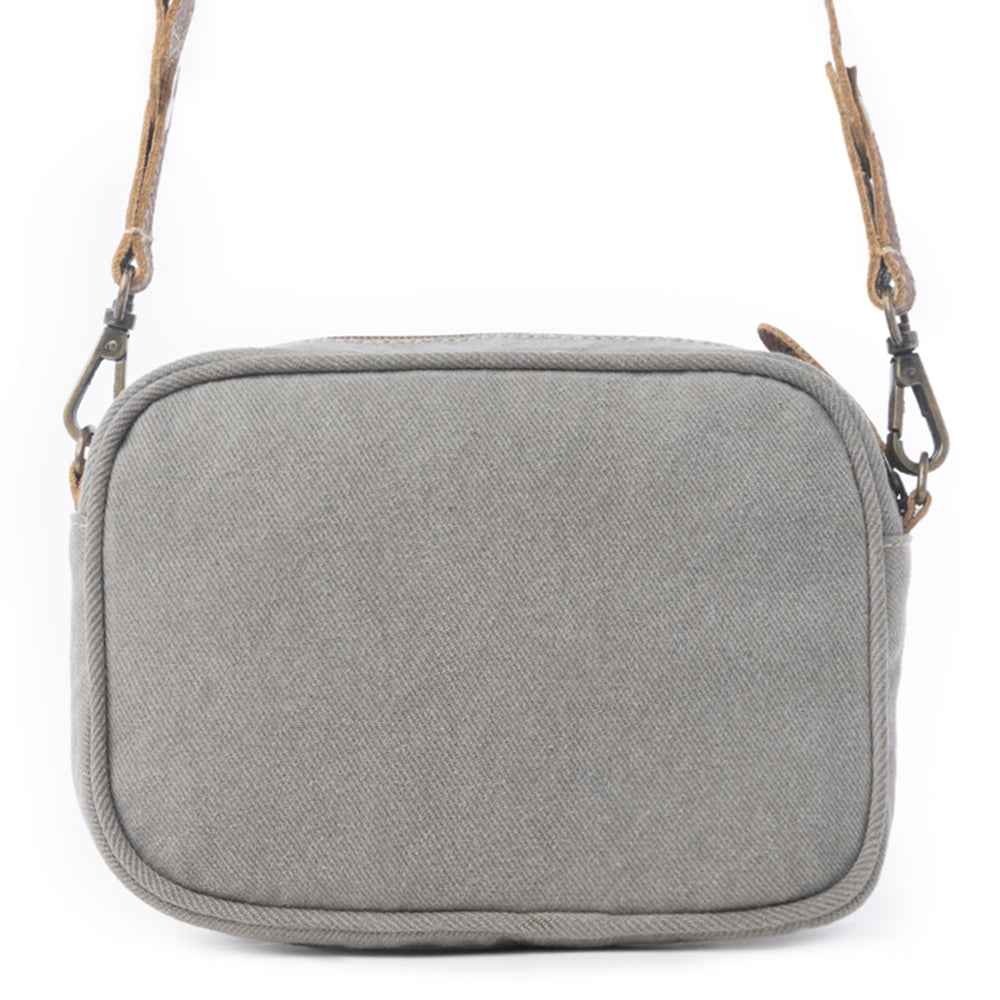 Back view of the Myra Temptation Tribal Crossbody Bag featuring gray upcycled canvas and an adjustable leather strap.