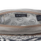 Interior view of the Myra Temptation Tribal Crossbody Bag showing the patterned cotton lining and zipper opening.