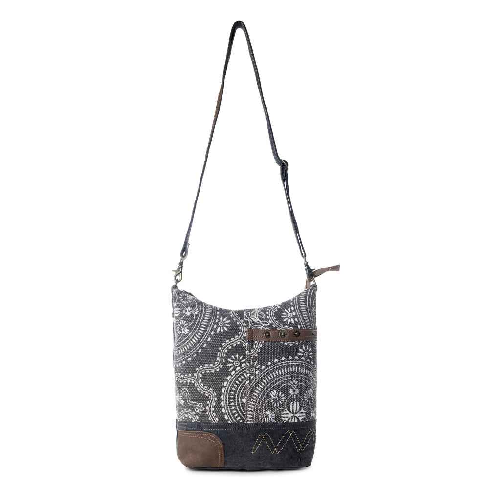 Full view of Myra Vintage Carved Shoulder Bag with adjustable shoulder strap and black and white vintage print