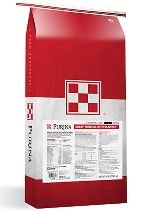Red and white Purina Sheep Mineral with ClariFly bag showing the product label.
