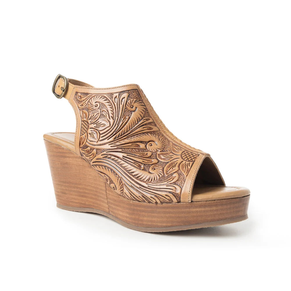 Angled view of Myra tan leather wedge sandal showing floral detailing, open toe, and platform sole.