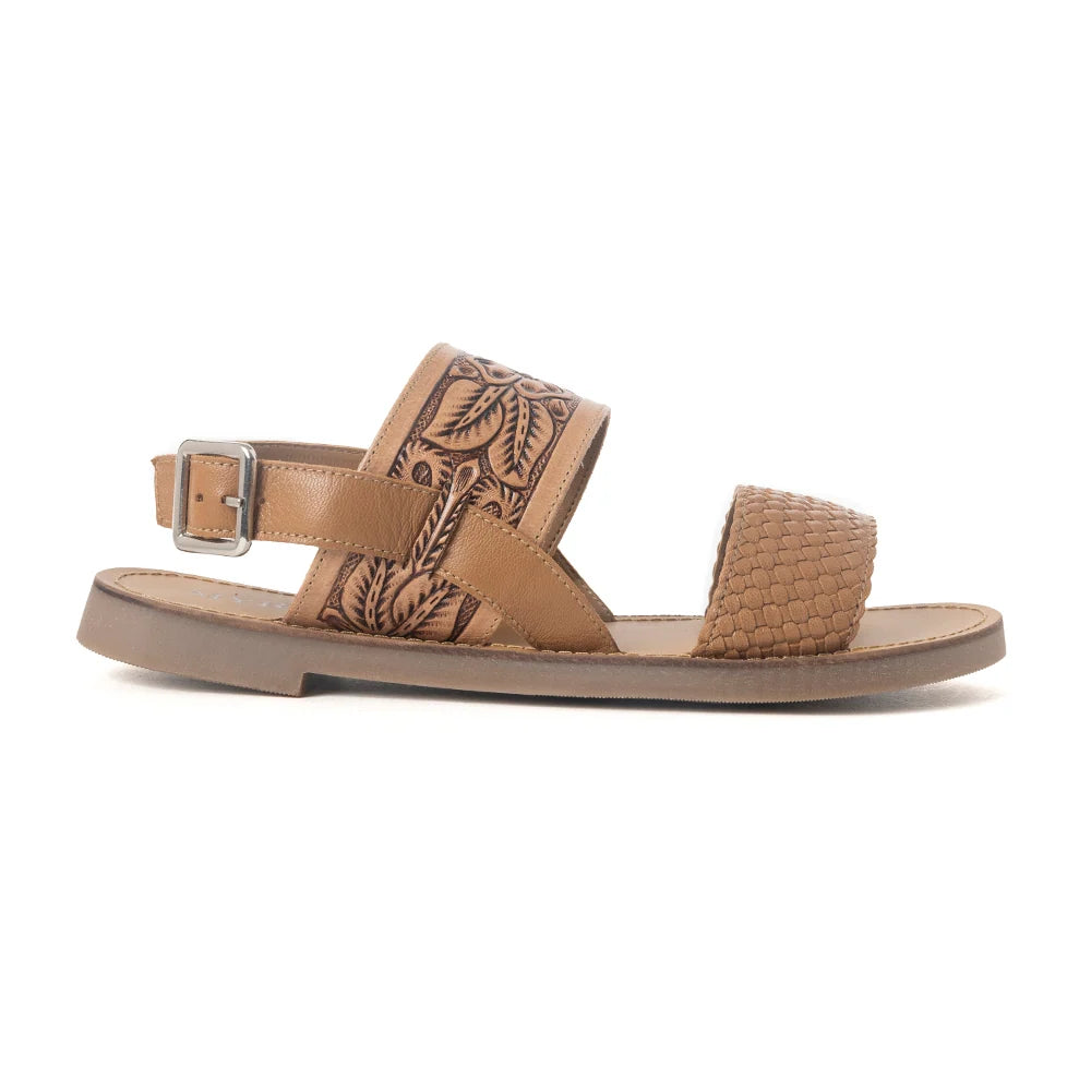 Side view of a Myra Pinehorn leather sandal showing the adjustable buckle heel strap and low-profile sole.