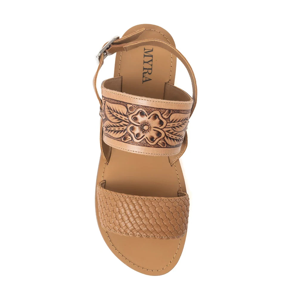  Top view of a Myra Pinehorn sandal showing floral hand-tooled leather and a woven-texture toe strap.