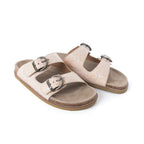 Pair of Myra Desert Lily Antique White sandals showing embossed leather straps and buckle details.