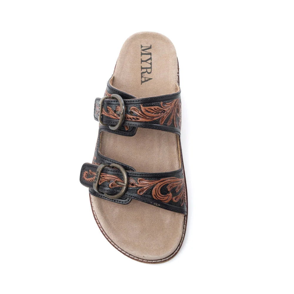  Top view of a Myra Canyon Ember sandal showing two buckled leather straps with brown tooling and a tan footbed.