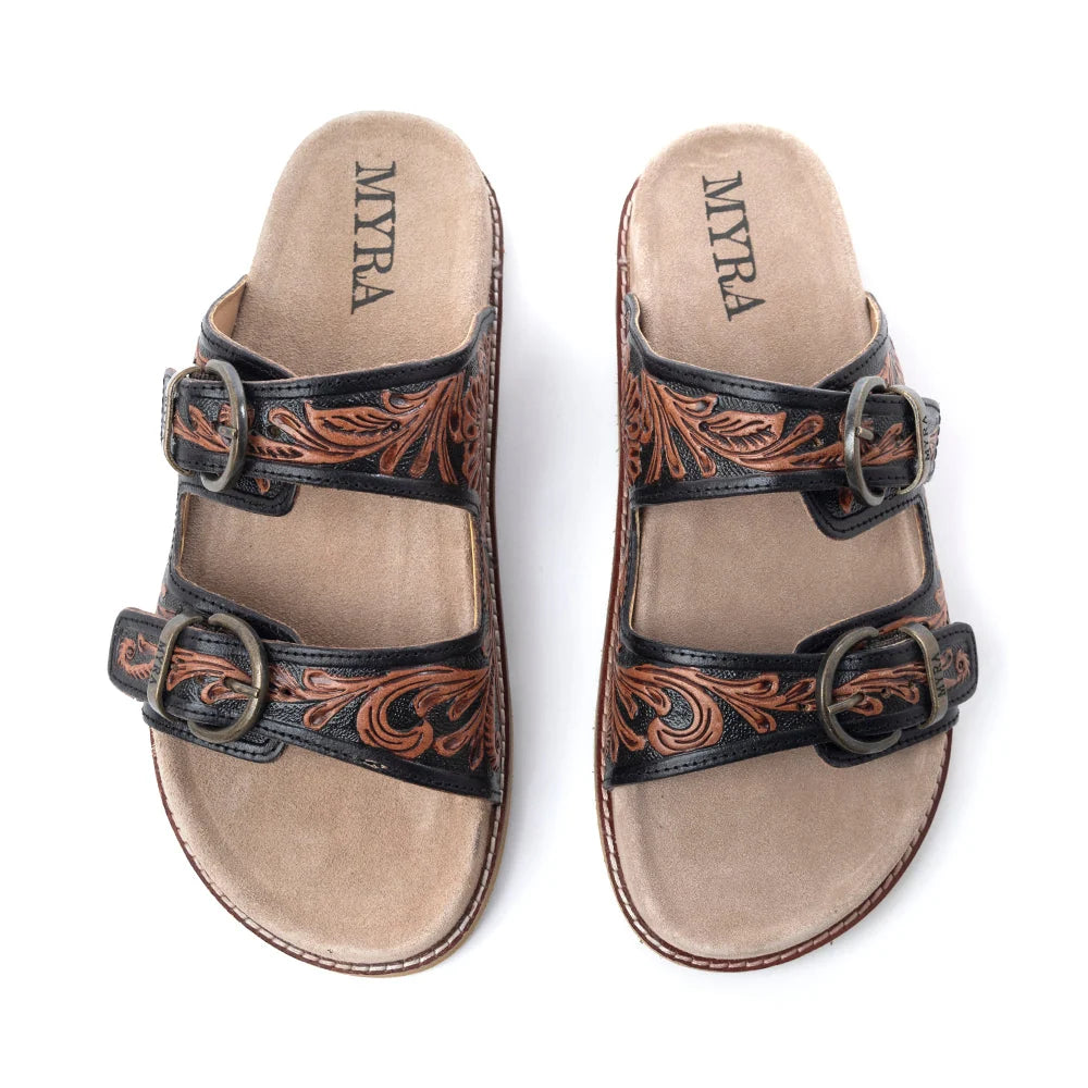 Myra Canyon Ember leather sandals with black double-buckle straps and brown floral tooling, shown from above.
