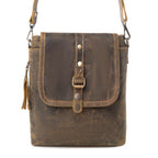 Brown leather bag with fringe detailing and front flap closure