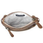 Open Myra Soul Searcher crossbody bag showing light patterned lining, interior slip pocket, and top zipper closure.
