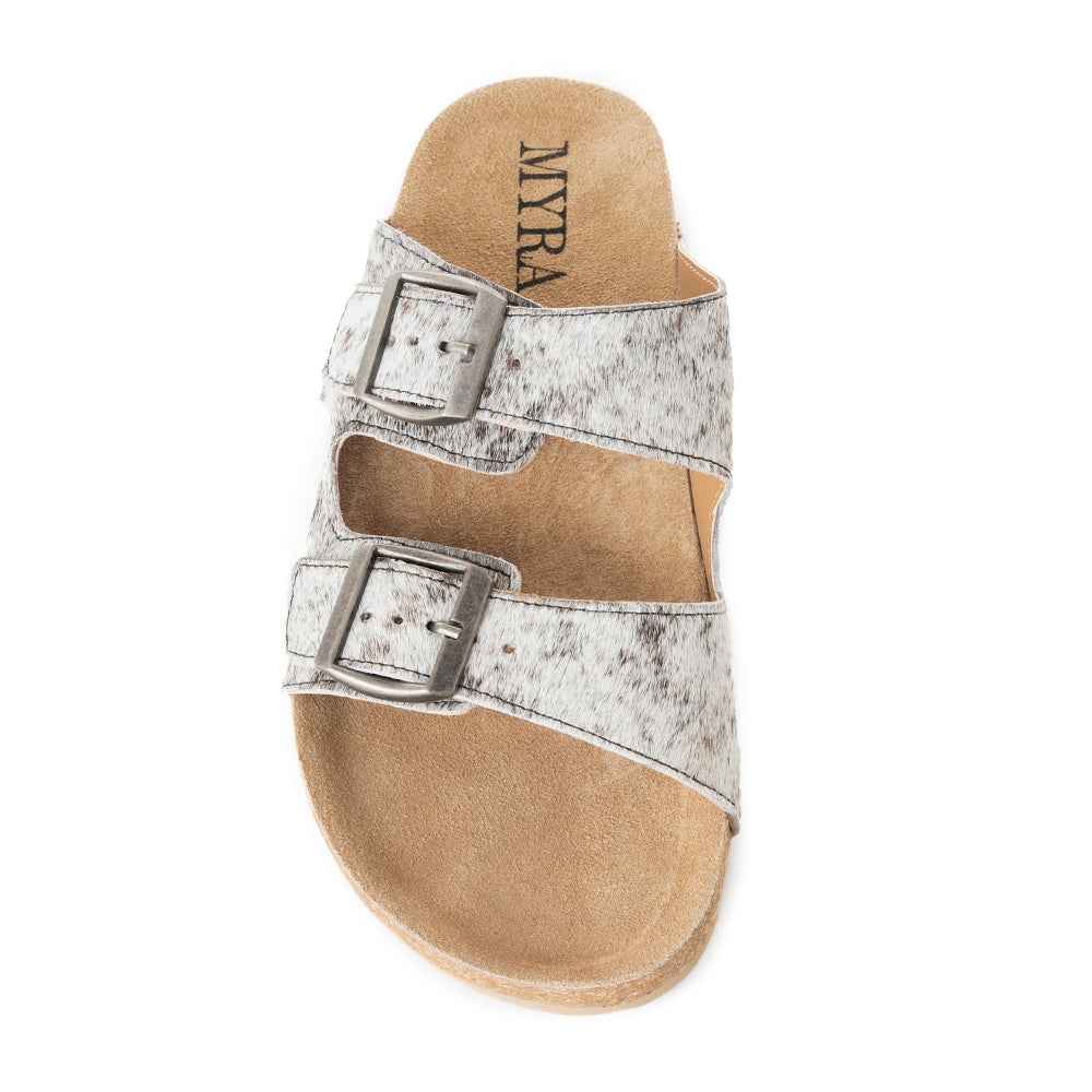 Top view of one Myra Lazy Days sandal with black-and-white cowhide straps and two silver-tone buckles.