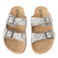 Myra Lazy Days Sandals with black-and-white cowhide straps, silver-tone buckles, and tan footbeds, top view.