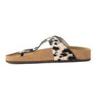 Side view of a Myra Chino sandal showing the cork sole and black and white hair-on leather strap.