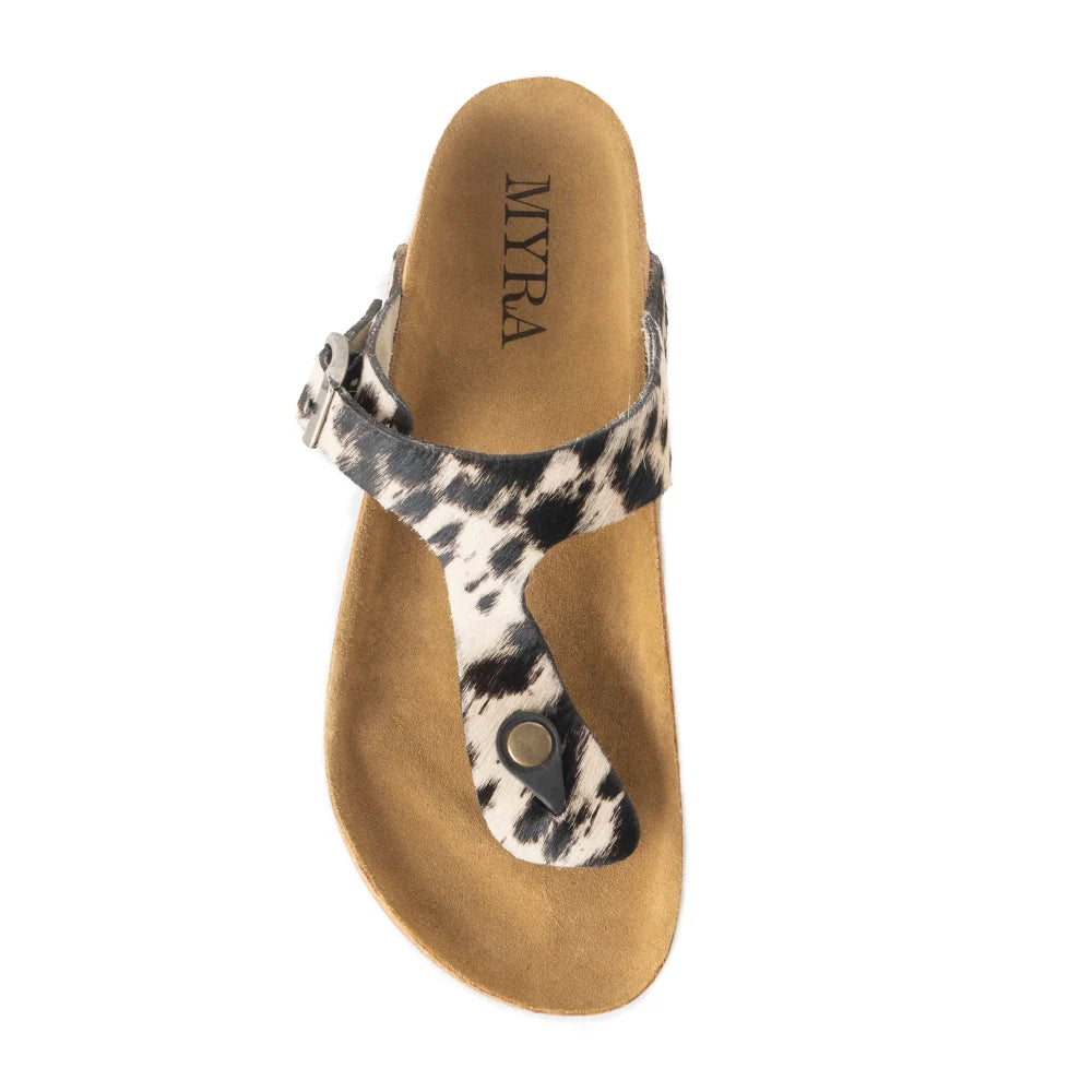 Single Myra Chino sandal viewed from above, showing the Myra-brand footbed, cowhide print thong strap, and adjustable buckle