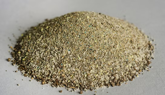 Close-up of Shegogg Creek Goat Mineral showing a mound of fine granules.