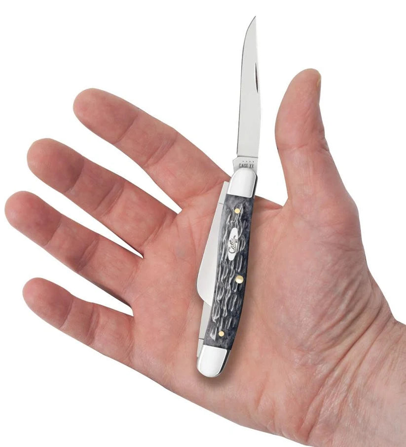 Case Gray Bone Medium Stockman pocket knife held in a hand with one blade open, showing its pocket size