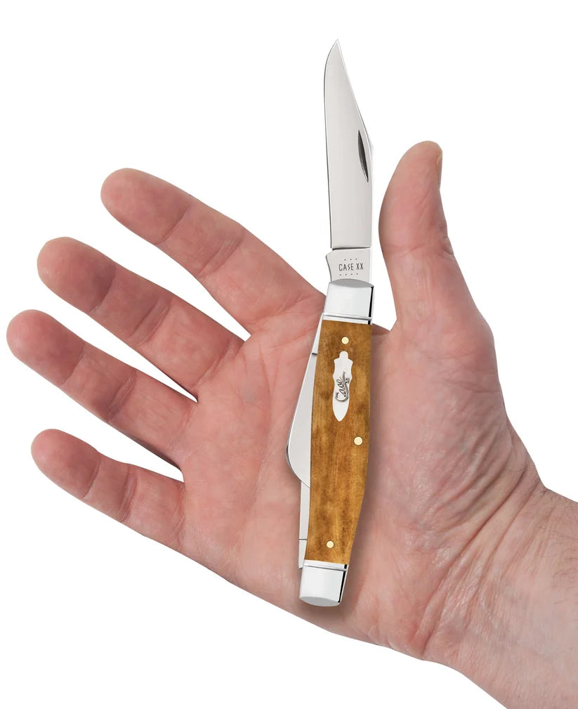 Case Smooth Antique Bone Large Stockman pocket knife held in a hand with Clip blade open