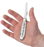 Case Worry Less, Pray More Mini Trapper pocket knife held in a hand with one blade open, showing its pocket size
