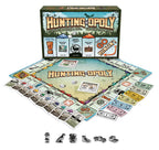 Hunting-Opoly new design board game setup with board, cards, play money, dice, and six outdoor-themed tokens