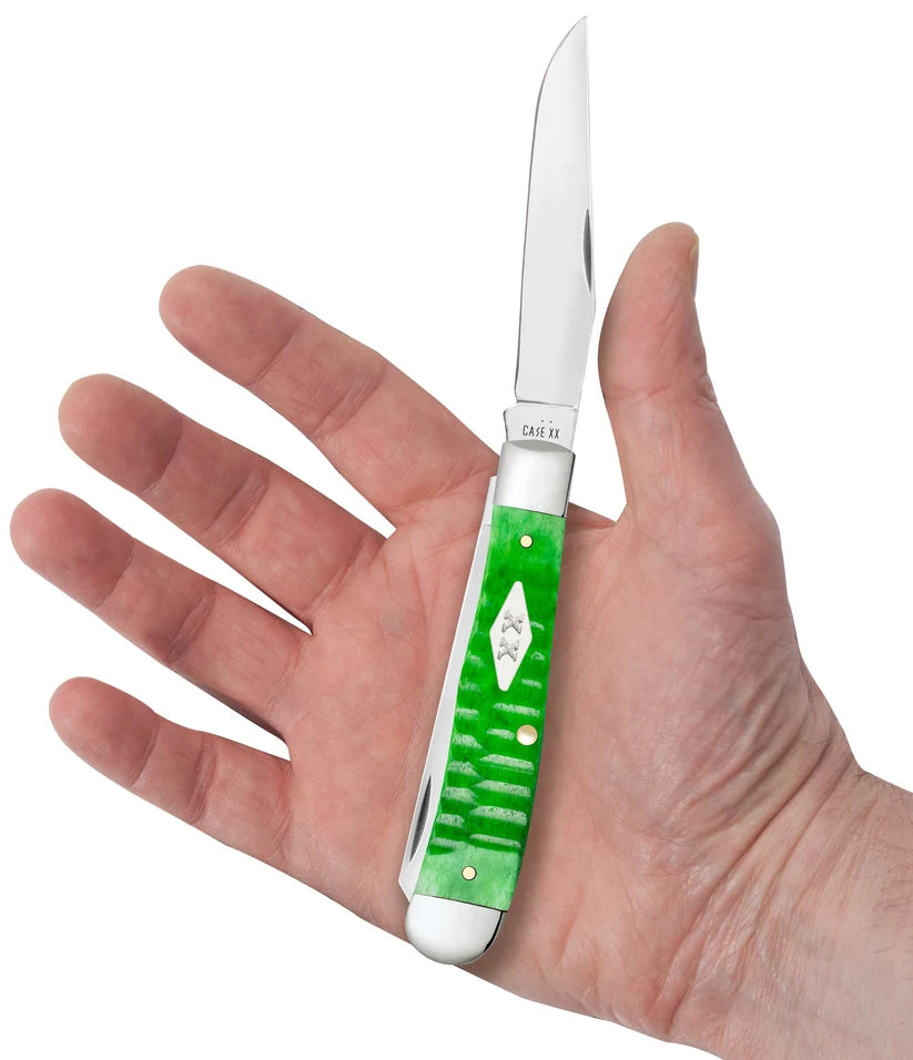 Case Gator Trapper pocket knife with bright green bone handle held in hand