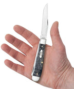 Case Pocket Worn Crandall Jig Gray Bone Trapper knife held in a hand with Clip blade open
