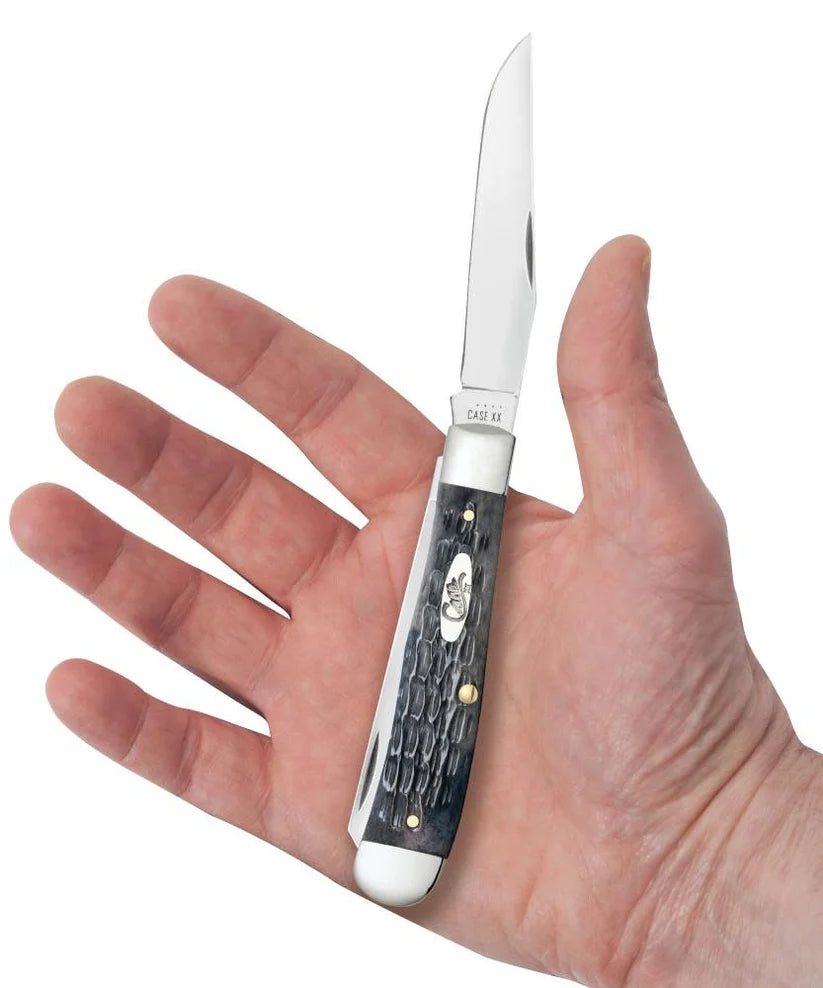 Case Pocket Worn Crandall Jig Gray Bone Trapper knife held in a hand with Clip blade open