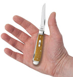 Case Smooth Antique Bone Mini Trapper pocket knife held in a hand with Clip blade open