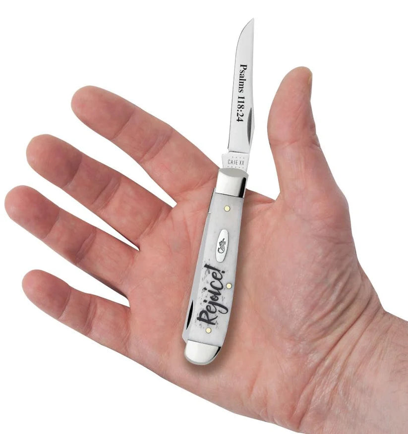 Case Rejoice Embellished Smooth Natural Bone Mini Trapper pocket knife held in a hand with one blade open, showing its pocket size