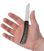 Case XR Sod Buster Jr. Black Burlap knife held in a hand with blade open