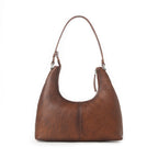 Western leather shoulder bag with comfortable strap and stitching