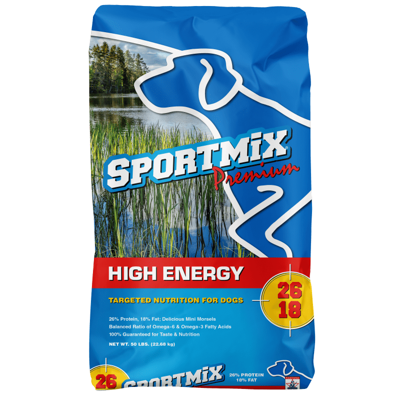 Front of a blue 50 lb bag of Sportmix Premium High Energy 26/18 dog food, showing the Sportmix dog logo, a lake scene, and the red 26/18 protein and fat badge