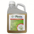 Roundup QuikPRO herbicide white jug with handle and green-and-orange label.