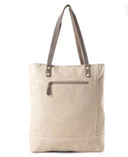Myra Cimple tote bag featuring genuine leather accents and a neutral canvas body