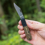 Open Case XR Barlow knife held in a hand outdoors