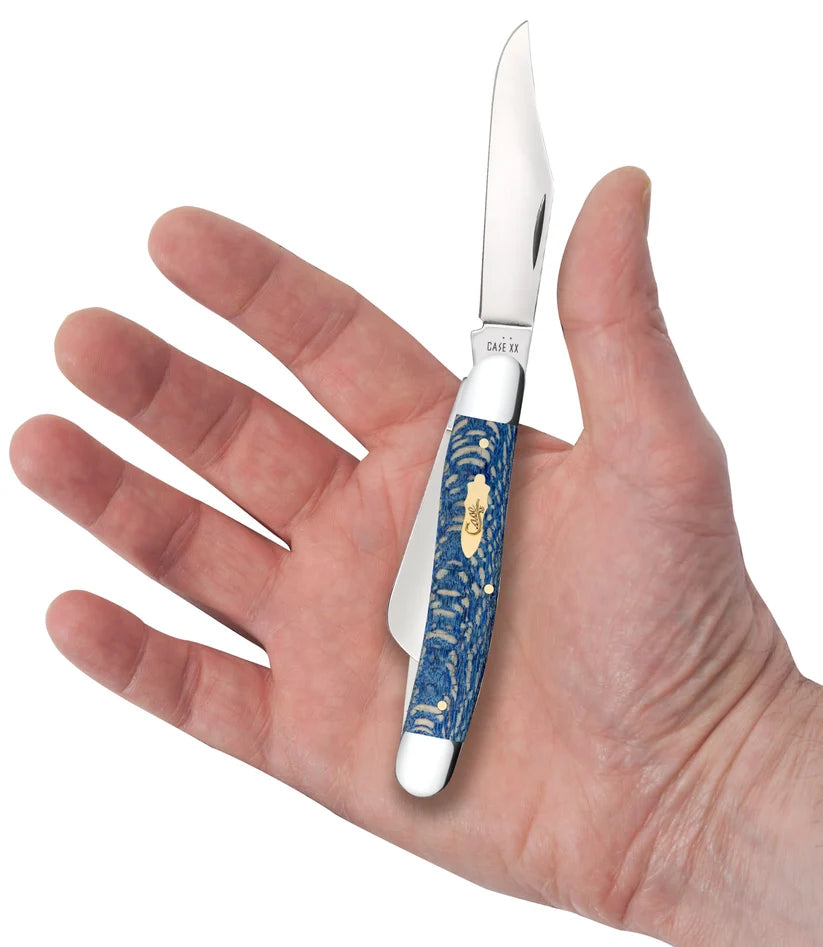 held in hand
Case Smooth Blue Sycamore Wood Stockman pocket knife held in an open palm with its clip-point blade extended