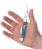held in hand
Case Smooth Blue Sycamore Wood Stockman pocket knife held in an open palm with its clip-point blade extended