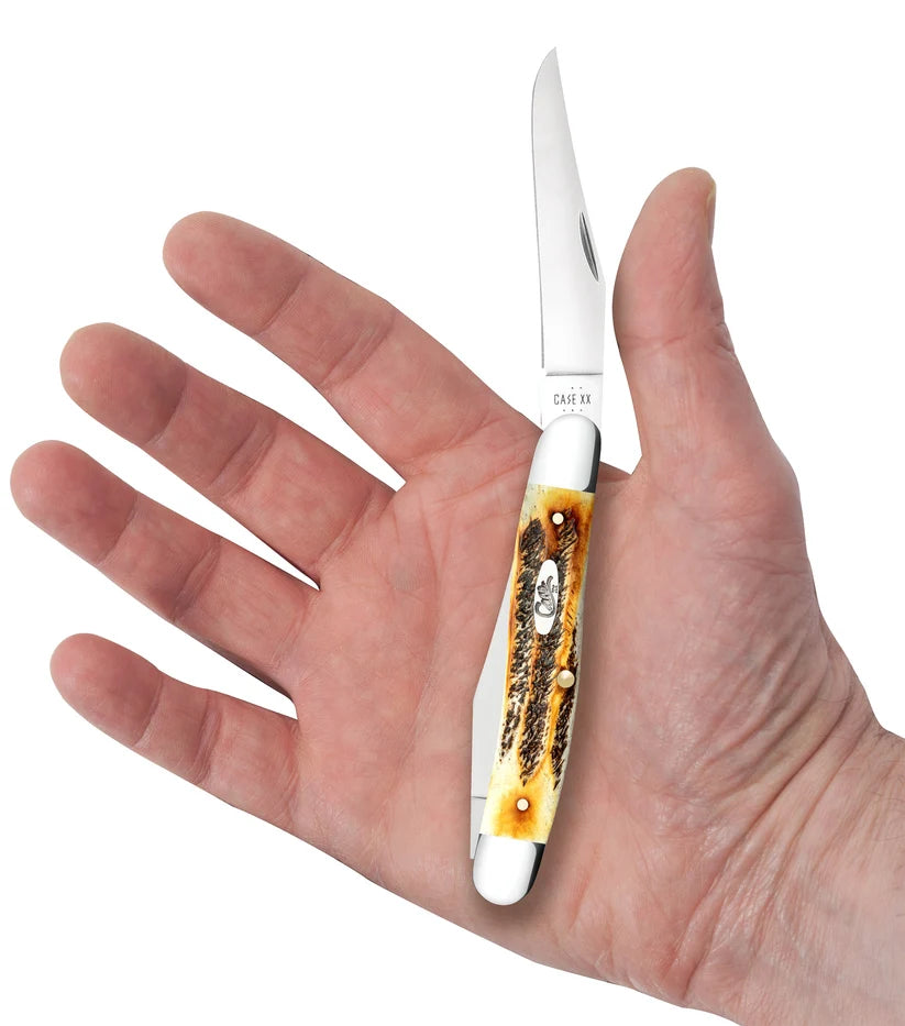 Case 6.5 BoneStag Muskrat knife held in a hand with one Clip blade open