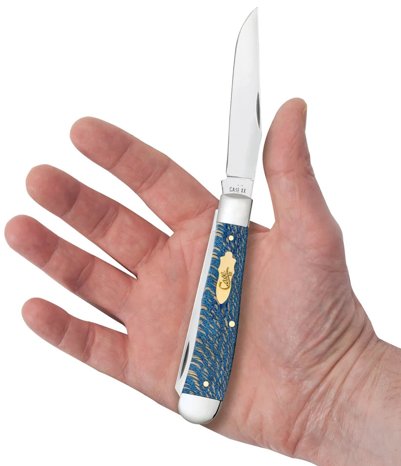 Case Smooth Blue Sycamore Wood Trapper pocket knife held in an open palm with its clip-point blade extended