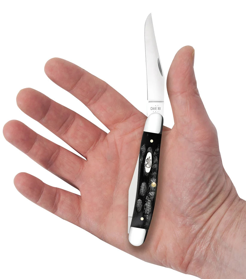 Case Jigged Buffalo Horn Muskrat knife held in a hand with one Clip blade open